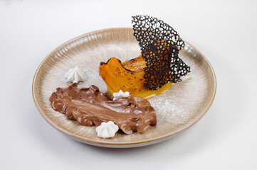 Desert of boiled pumpkin with chocolate cream