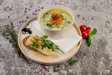 Pumpkin soup with herbs and sandwich