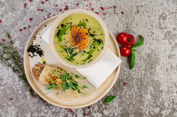 Pumpkin soup with herbs and sandwich