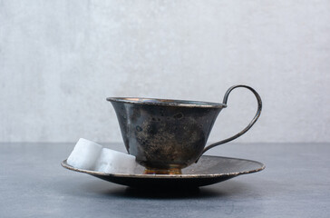 A glass of aroma dark tea on gray background