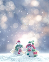 Merry Christmas and happy New Year greeting card with copy space.Two snowmen standing in snow. Christmas landscape. Winter background.