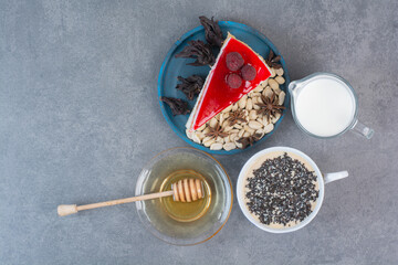 A piece of delicious cake with honey and milk