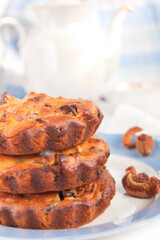 Sweet muffins with dried fruit on the white background