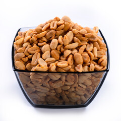 pile of spiced peanuts isolated close up on white background 
