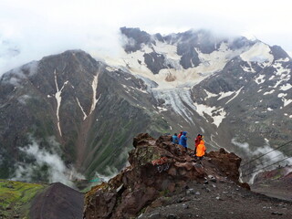 Mountain slopes of the Elbrus region with snow, glaciers and clouds. Elbrus region,...