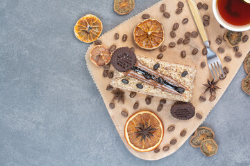 Fototapeta premium A wooden cutting board with dried oranges and coffee beans
