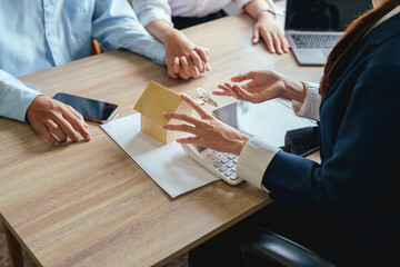 Portrait of a real estate agent or bank officer, the lending department quotes the interest on the...