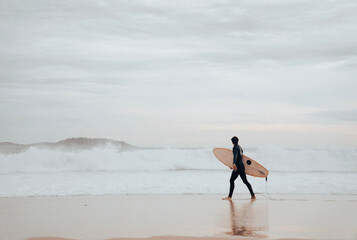 A surfer on Ipanema Beach, Brazil.