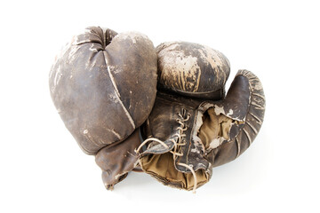 vintage worn leather brown boxing gloves isolated on white background