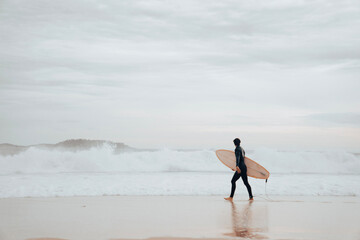 A surfer on Ipanema Beach, Brazil.