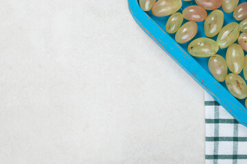 Bunch of grapes on blue plate with tablecloth