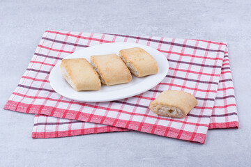 Cream filled biscuits on white plate