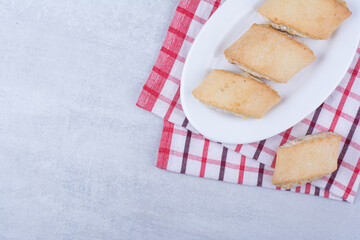 Cream filled biscuits on white plate