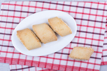 Cream filled biscuits on white plate