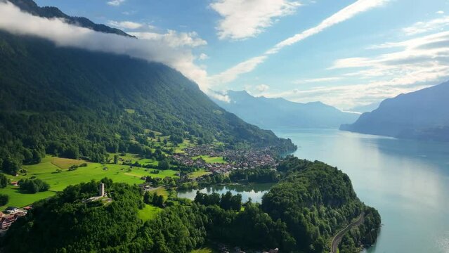 idyllic Swiss landscape on a beautiful foggy morning, aerial view of the town of Interlaken, famous tourist destination in Switzerland