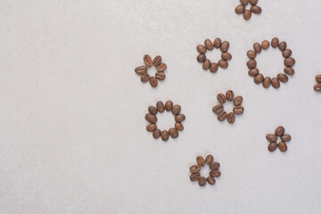 Roasted coffee beans on white background