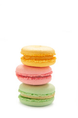 A vertical stack of three macarons isolated on white background. Sweet dessert