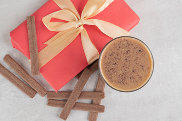 Coffee, biscuits and gift box in marble surface