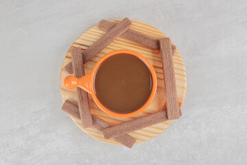 Aroma coffee and cocoa biscuits on wooden plate