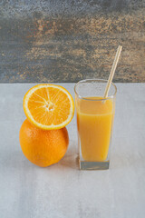 Cold and refreshing citrus cocktail with orange and straw