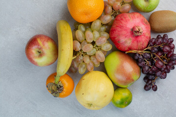 Bunch of various fruits on stone background
