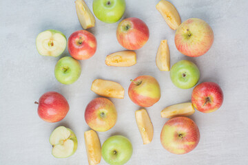 Bunch of red and green apples on stone table