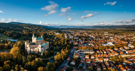 panorama view of Bojnice village and the historic fairy tale castle in Slovakia in autumn colors