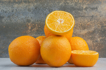 Fresh ripe oranges on stone table