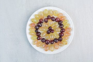 Fresh grapes plate on stone background
