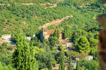 Fototapeta na wymiar Castelnou,Église Sainte-Marie du Mercadal vu du château,Pyrénées orientales,Occitanie.