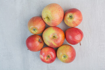 Bunch of fresh apples on stone background