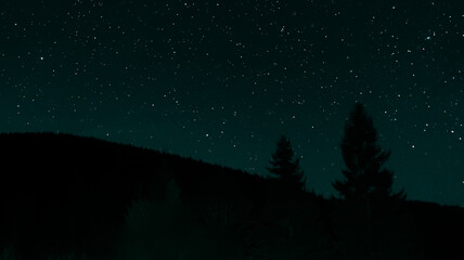 Mountain landscape during the night with stars and clear sky. Stars at night