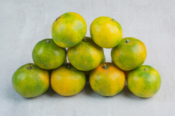 Bunch of fresh mandarines on stone background