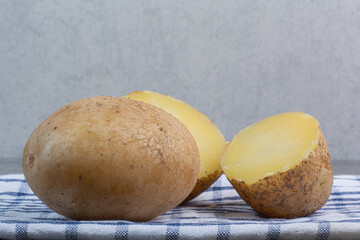 Boiled delicious whole potatoes on tablecloth