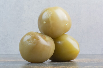 Some of salty delicious olives on marble background