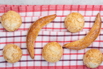 Variety of sweet biscuits on striped tablecloth