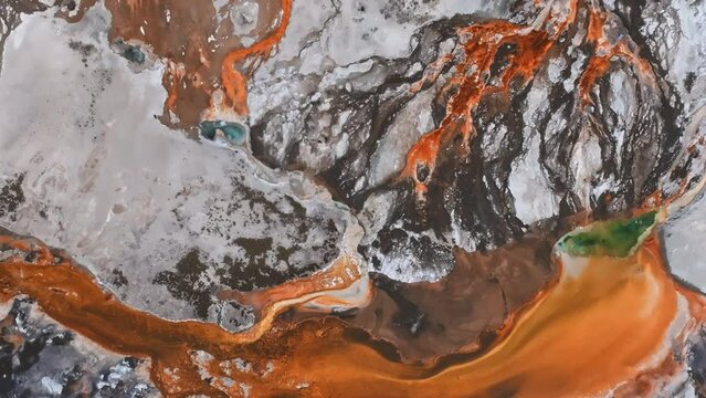 Aerial video of deep green blue geyser pool in the Yellowstone National Park. Scenic view over colorful Norris Geyser Basin in Yellowstone National Park