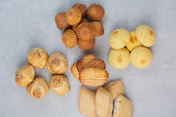 Bunch of homemade biscuits on gray background