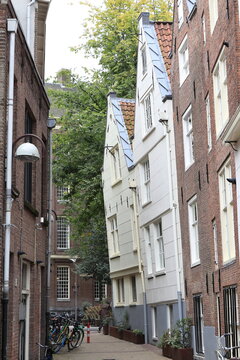 Amsterdam Gedempte Begijnensloot Street View with Crooked House Facades, Netherlands