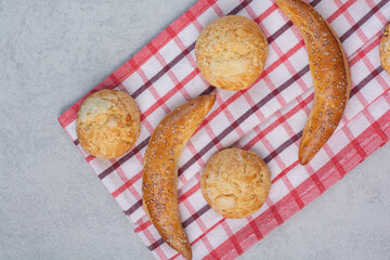 Variety of sweet biscuits on striped tablecloth