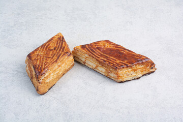 Two walnut biscuits on gray background