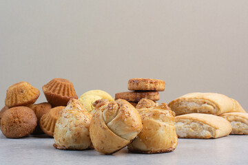 Bunch of homemade biscuits on gray background