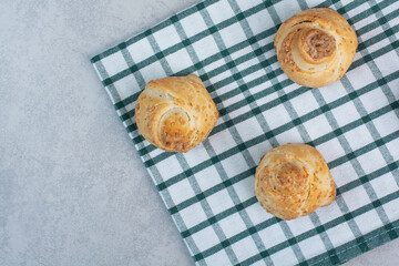 Sweet homemade biscuits on striped tablecloth