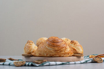 Variety of sweet biscuits on wooden plate