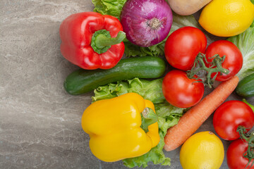 A lot of fresh vegetables on marble background