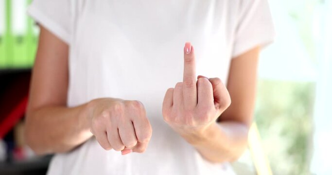 Female hand showing gesture with hand fuck holding middle finger