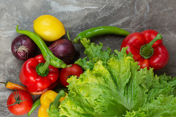 A lot of fresh vegetables on marble background