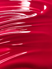 Glossy red cosmetic texture as beauty make-up product background, skincare cosmetics and luxury...