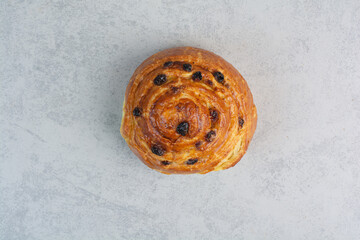 Sweet delicious pastries on dark board