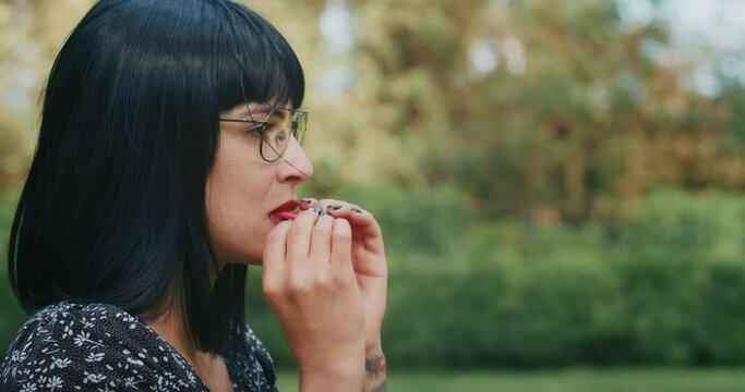 a happy woman inflates balloons and they burst, showing that everything is wrong with condoms and they are torn.